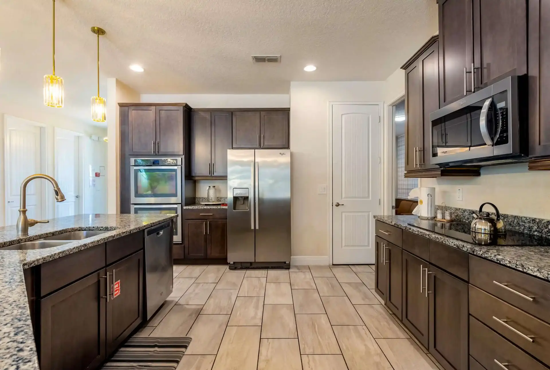 Modern kitchen with double oven and stainless appliances