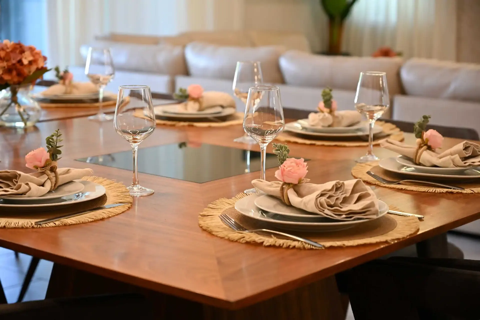 Dining table place settings with wine glasses