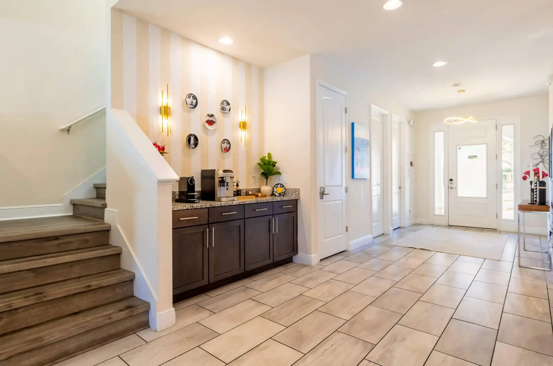 Entry hallway with coffee bar and staircase