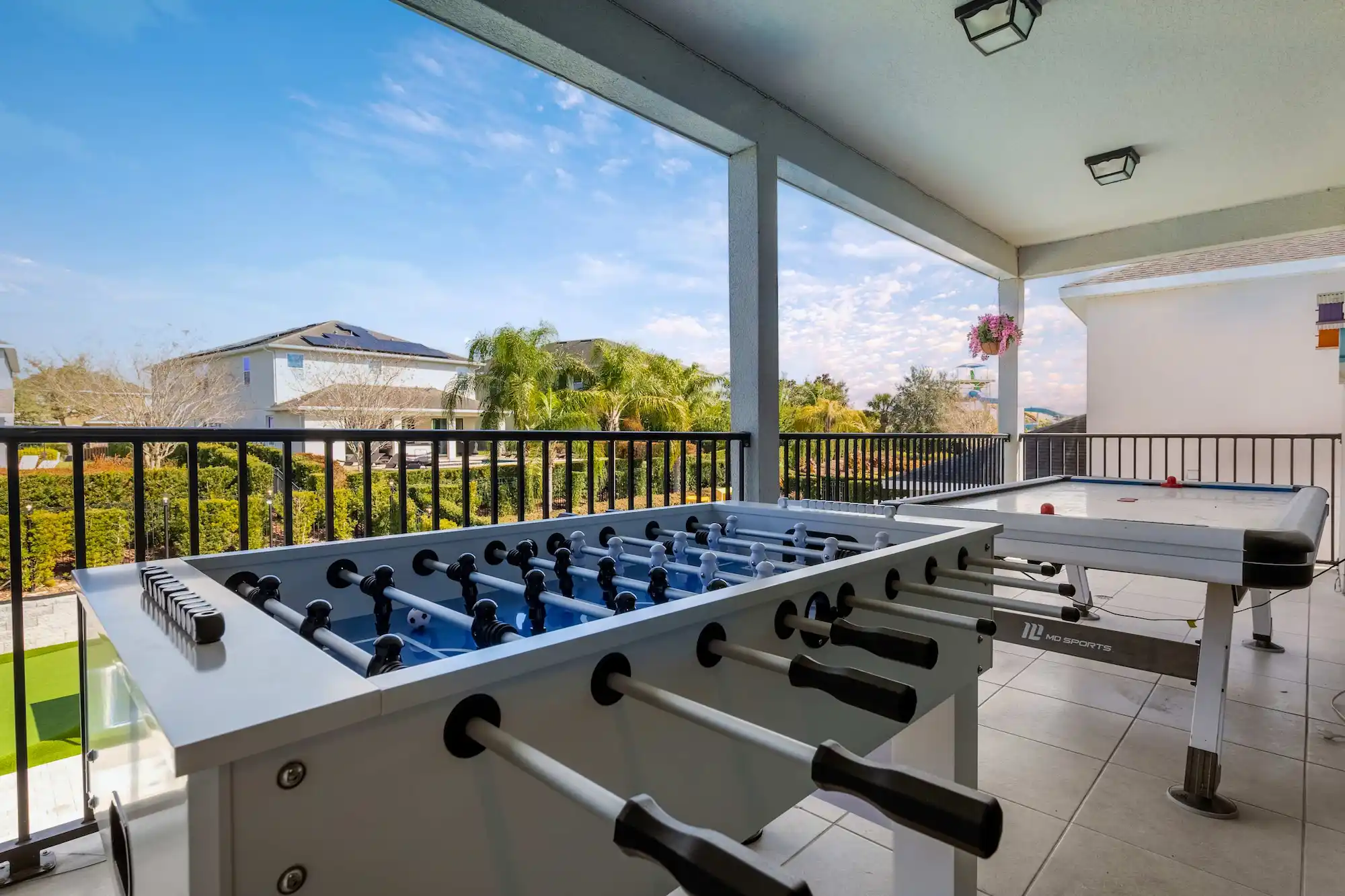 Covered balcony with foosball and air hockey
