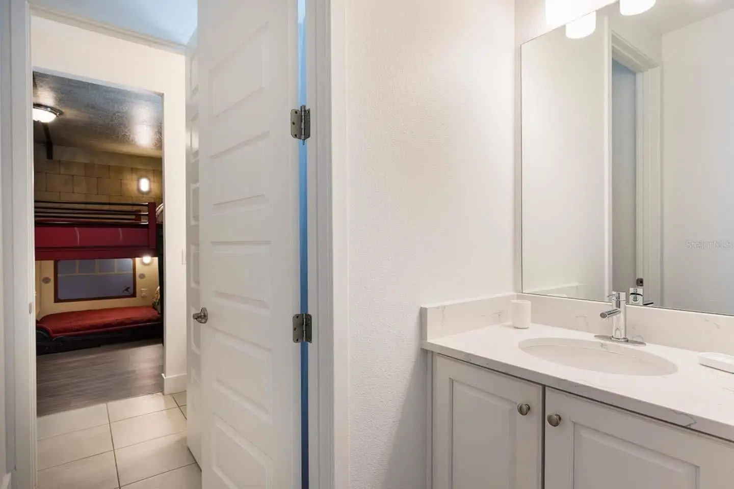 Vanity outside themed bunk bedroom