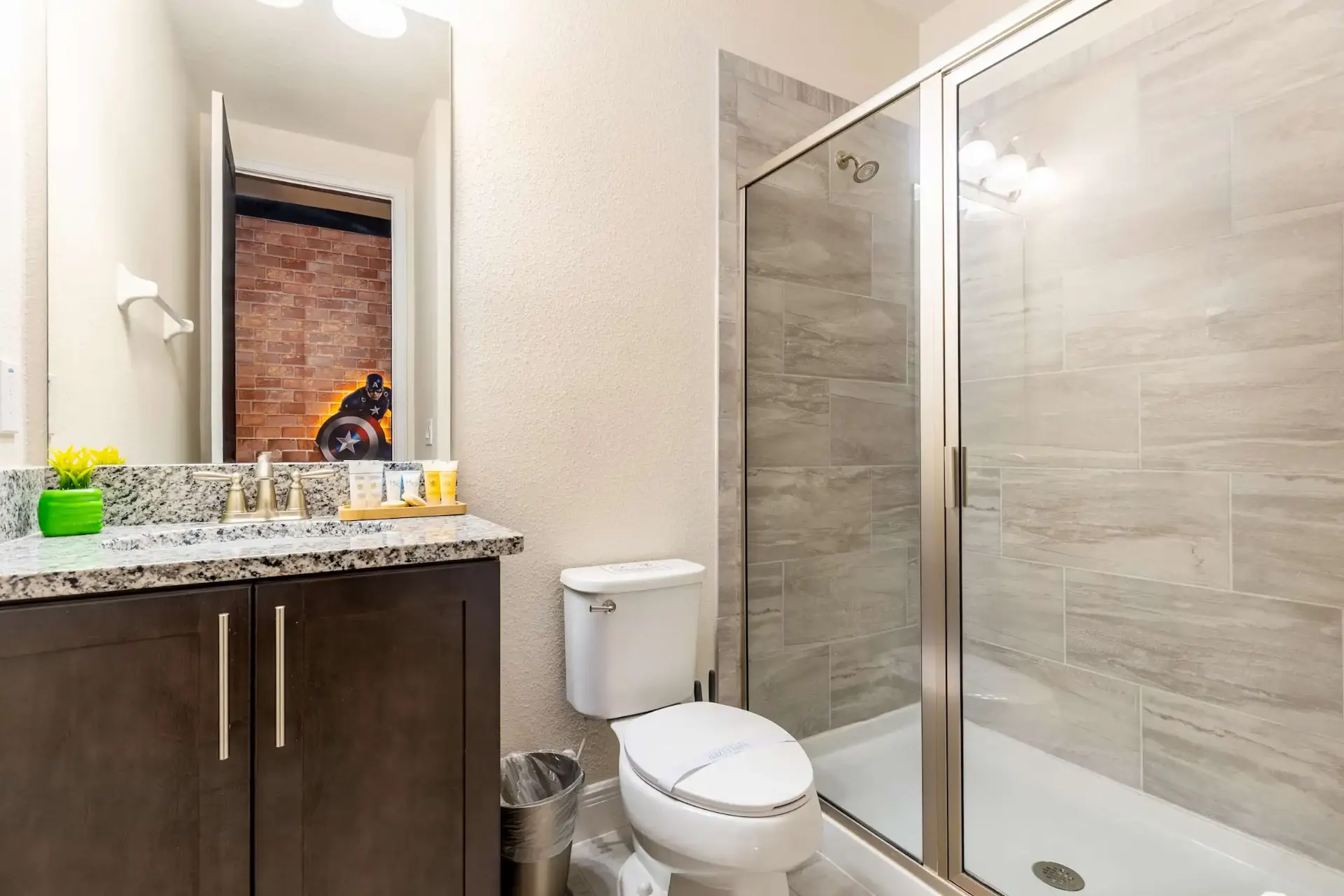 Guest bathroom with granite vanity and walk-in shower