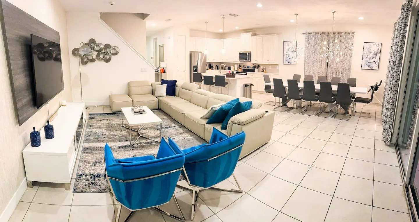 Open-plan lounge, kitchen and long dining table