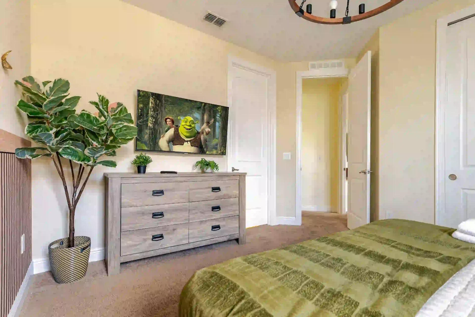 wellness retreat bedroom shrek dresser tv vacation rental orlando