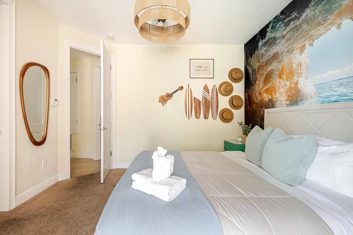 wellness retreat bedroom surfboard decor king bed orlando