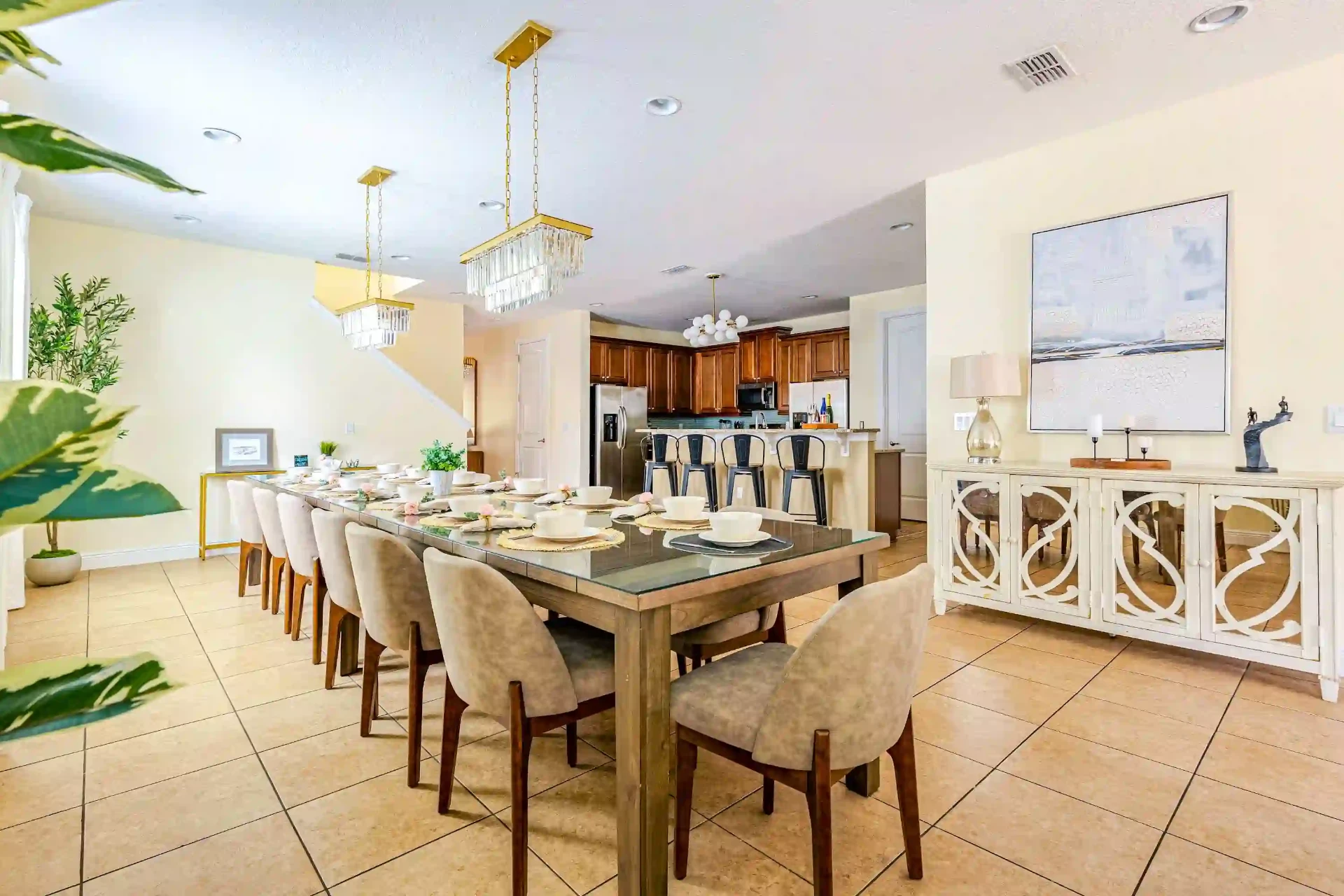 Dining room with crystal chandelier and open kitchen beyond