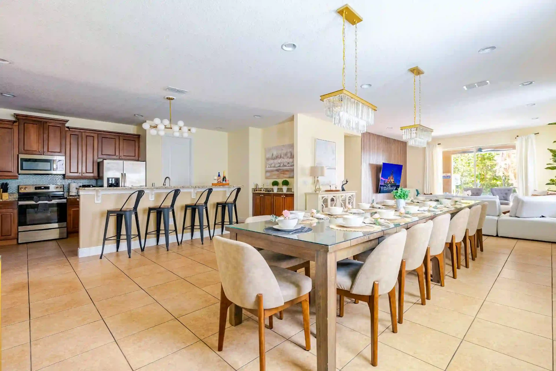 Open-plan kitchen, dining and living area with Disney feature wall